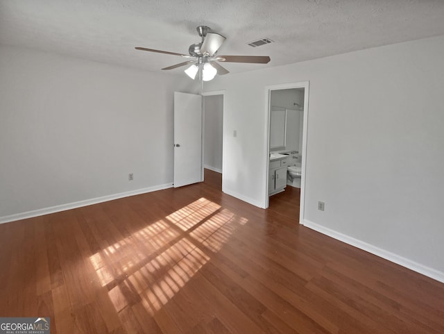 2268 Turtle Club Dr NE, Marietta, GA 30066 - unfurnished bedroom featuring wood finished floors, a ceiling fan, and ensuite bath