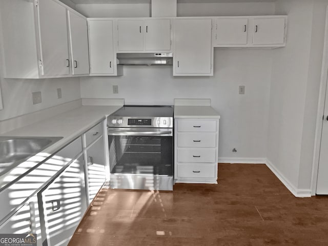 2268 Turtle Club Dr NE, Marietta, GA 30066 - kitchen featuring electric stove, under cabinet range hood, white cabinetry, light countertops, and dark wood-style floors