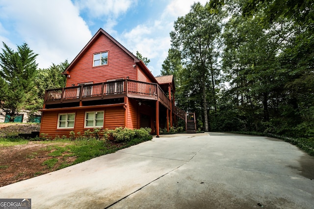 view of property exterior featuring a deck