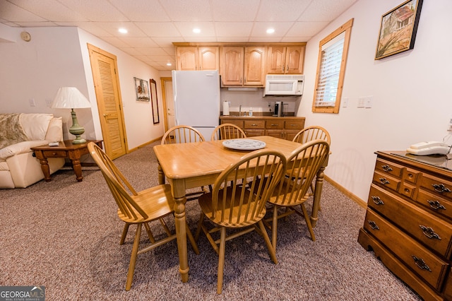 view of carpeted dining area