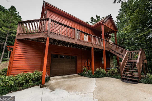 view of front of home with a garage and a deck