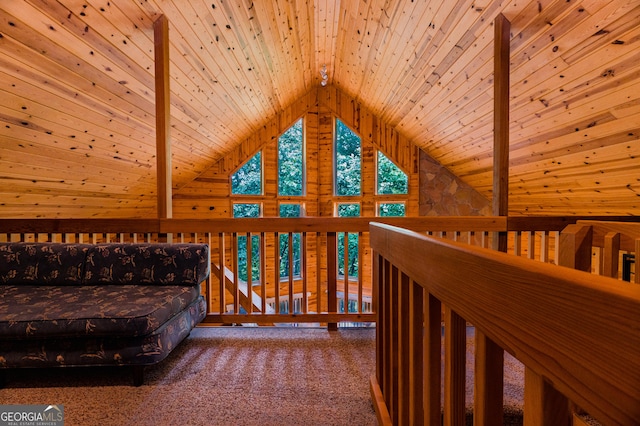 unfurnished bedroom with lofted ceiling with beams, carpet flooring, and wooden ceiling