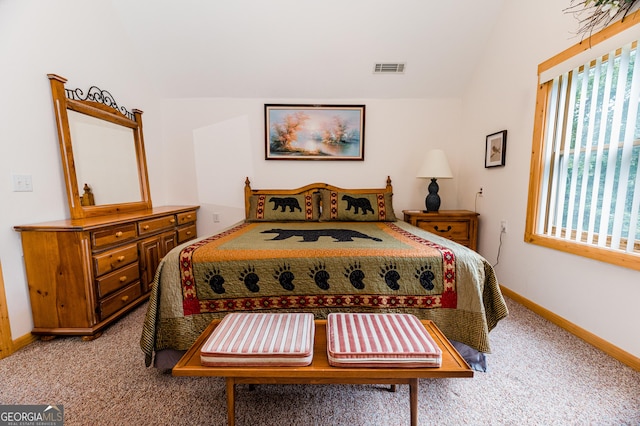 bedroom with light colored carpet