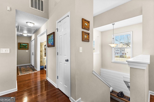 hallway with dark wood-type flooring