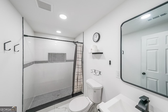 bathroom with walk in shower, sink, and toilet