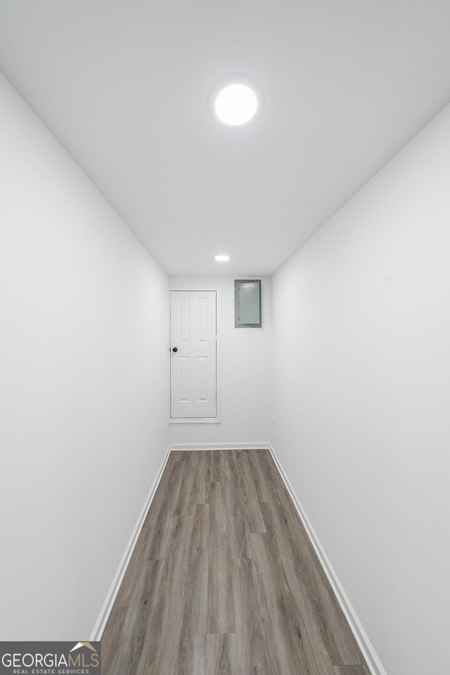 hallway featuring wood-type flooring