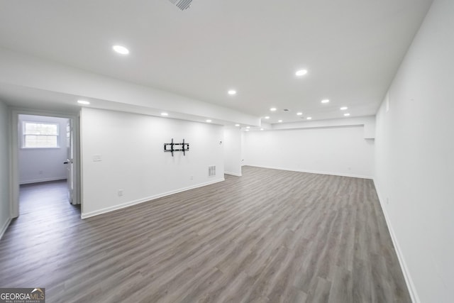 basement featuring hardwood / wood-style floors