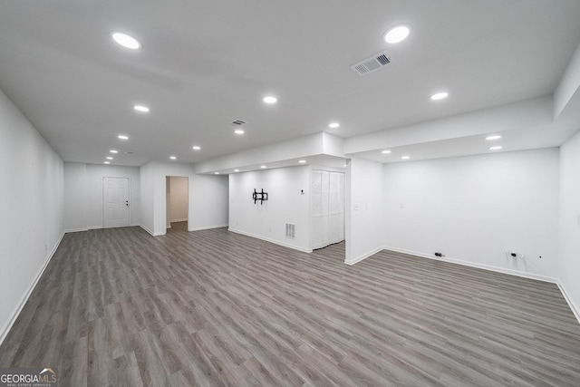 basement with hardwood / wood-style flooring