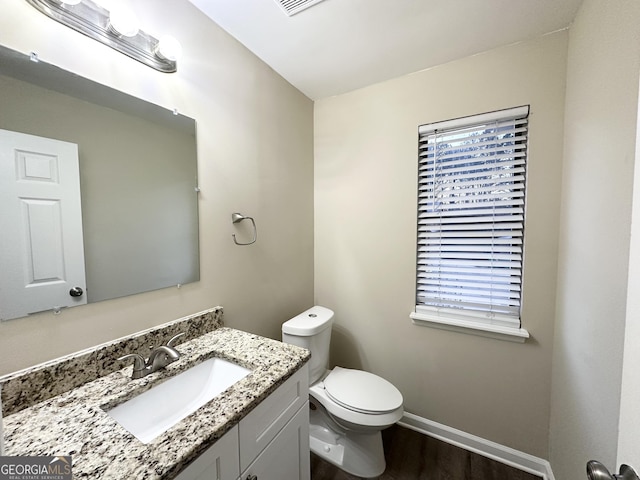 3880 Springleaf Ct, Stone Mountain, GA 30083 - bathroom with vanity, wood-type flooring, and toilet