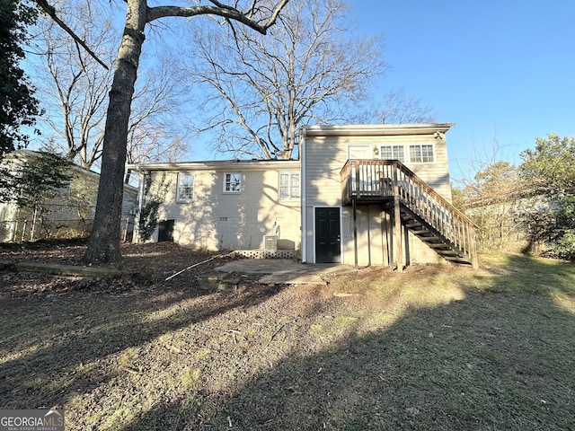 rear view of house with a yard