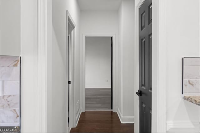 hallway featuring dark hardwood / wood-style floors