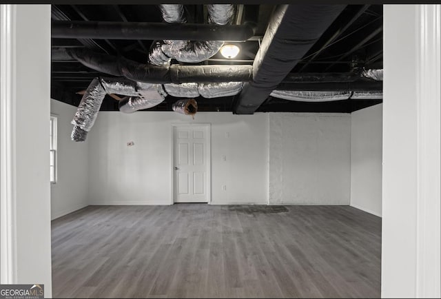 basement with wood-type flooring