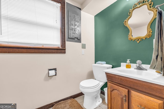 bathroom with tile patterned floors, toilet, and vanity