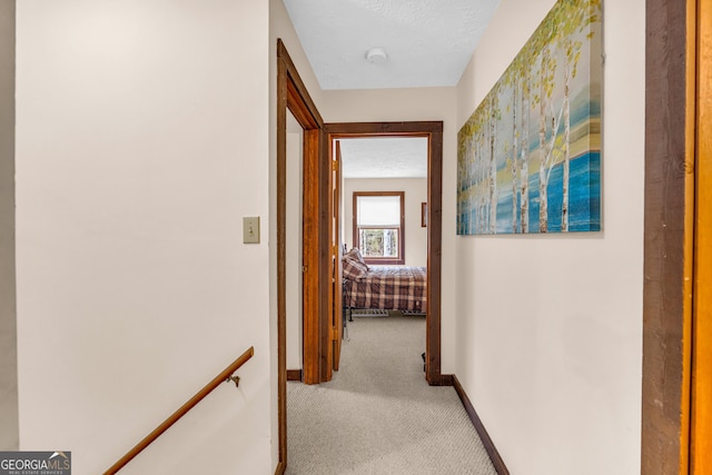 hallway with light carpet