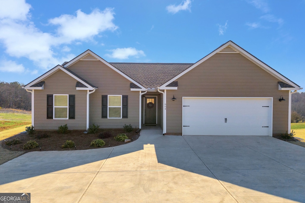 ranch-style house featuring a garage