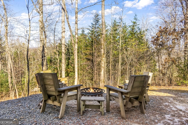 view of patio / terrace featuring an outdoor fire pit