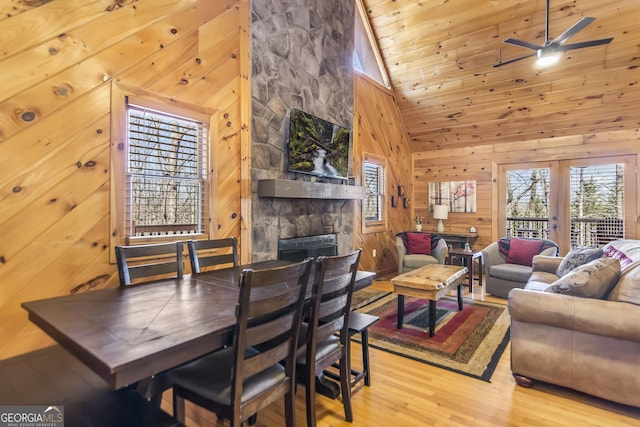 211 Highland Forest Dr, Morganton, GA 30560 - dining room featuring wooden walls, ceiling fan, wood finished floors, and a fireplace