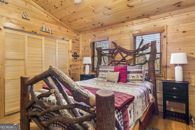 211 Highland Forest Dr, Morganton, GA 30560 - bedroom with wood ceiling, vaulted ceiling, wood finished floors, a closet, and wooden walls