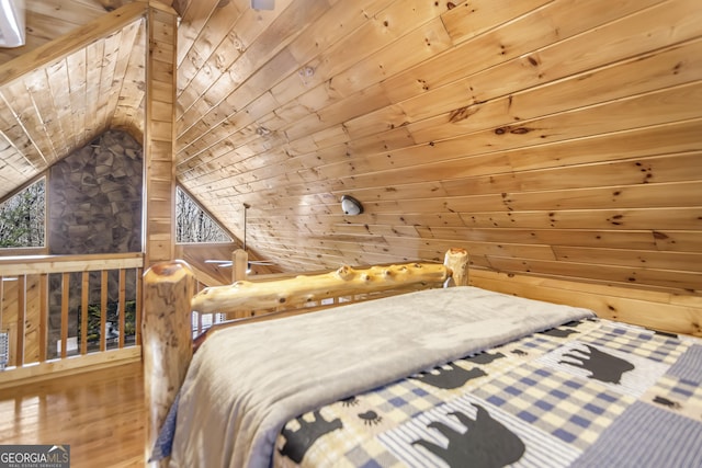 bedroom featuring lofted ceiling, wooden ceiling, and wood walls