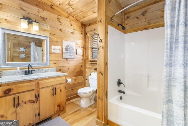 full bathroom featuring shower / bathtub combination with curtain, wood-type flooring, wooden walls, and wooden ceiling