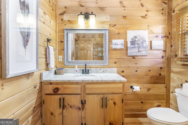 211 Highland Forest Dr, Morganton, GA 30560 - bathroom featuring vanity, toilet, and wood walls
