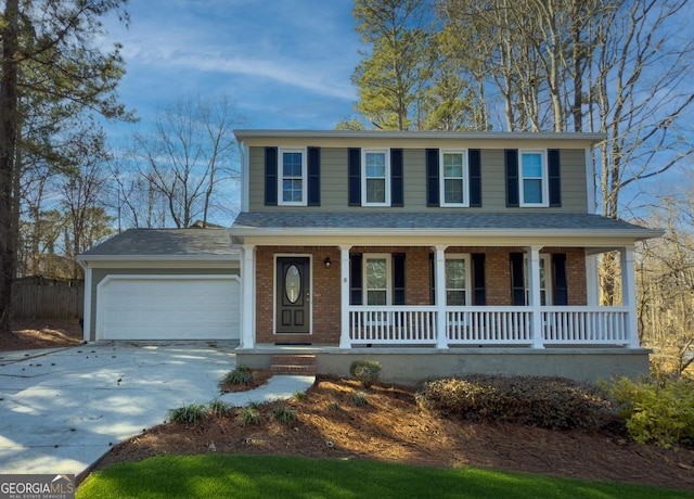 view of front of property with a porch and a garage