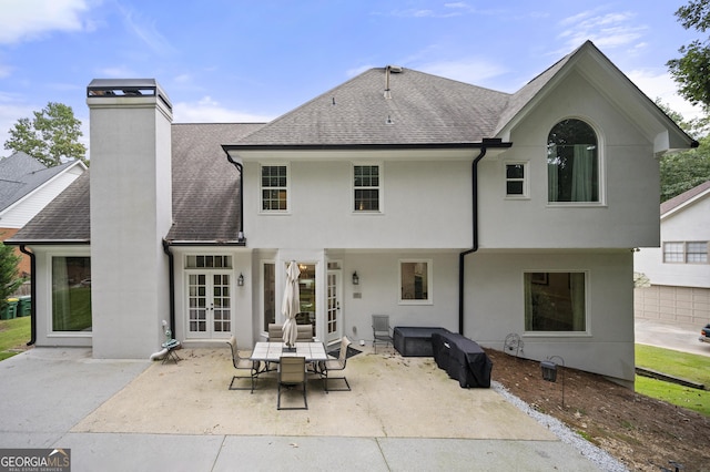 back of property featuring a patio and french doors