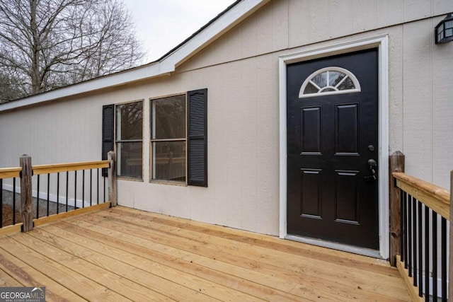 entrance to property with a wooden deck