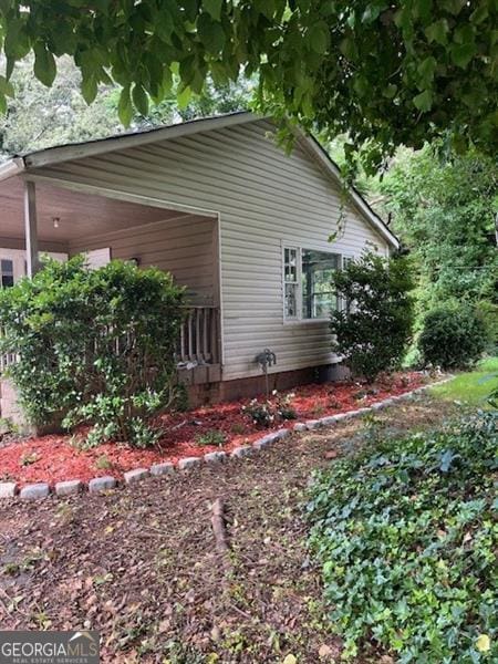 4402 Highland Rd, Decatur, GA 30035 - view of home's exterior featuring a carport