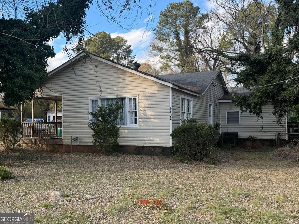 view of property exterior featuring a yard