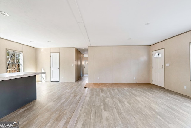 unfurnished living room with light hardwood / wood-style flooring