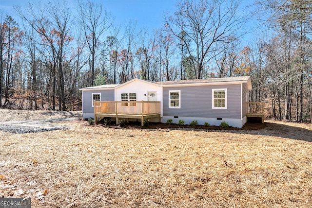 manufactured / mobile home with a wooden deck