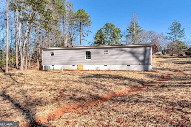 rear view of property with central air condition unit