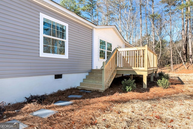 view of side of home featuring a deck