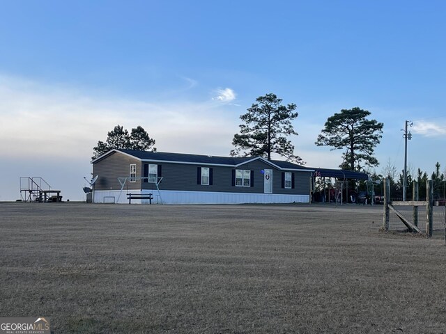 manufactured / mobile home featuring a carport