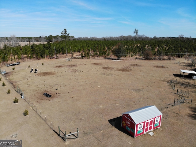 birds eye view of property with a rural view