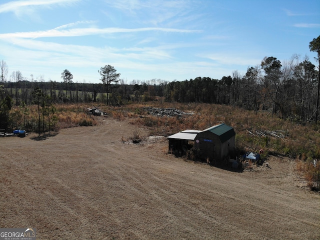 birds eye view of property featuring a rural view