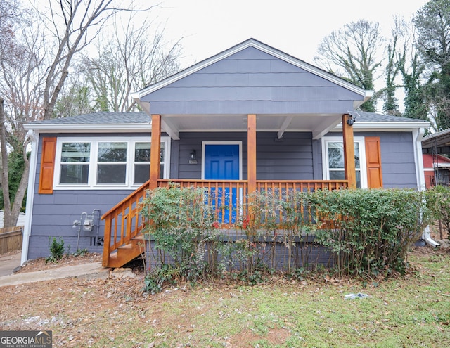 view of front of house featuring a porch and a shingled roof