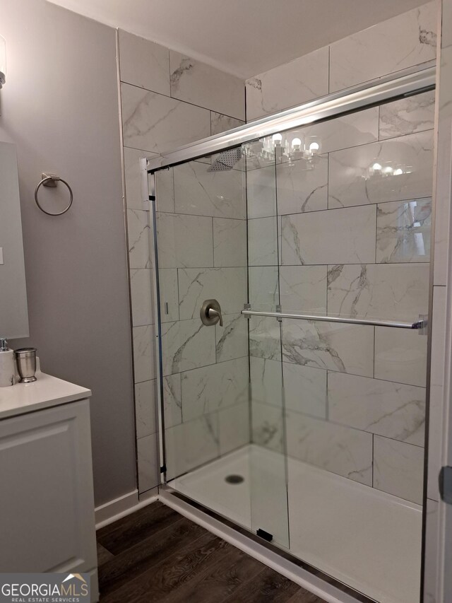 1290 Elizabeth Ave SW, Atlanta, GA 30310 - bathroom with a stall shower, vanity, and wood finished floors
