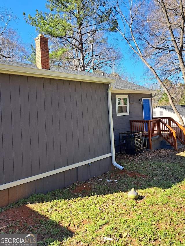 1290 Elizabeth Ave SW, Atlanta, GA 30310 - view of side of home with a chimney and roof with shingles