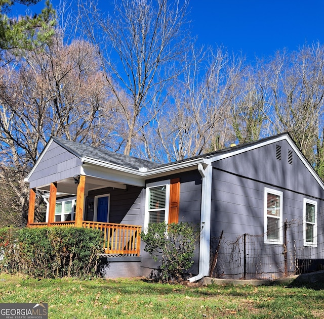 1290 Elizabeth Ave SW, Atlanta, GA 30310 - view of side of property featuring a porch, a shingled roof, and a lawn