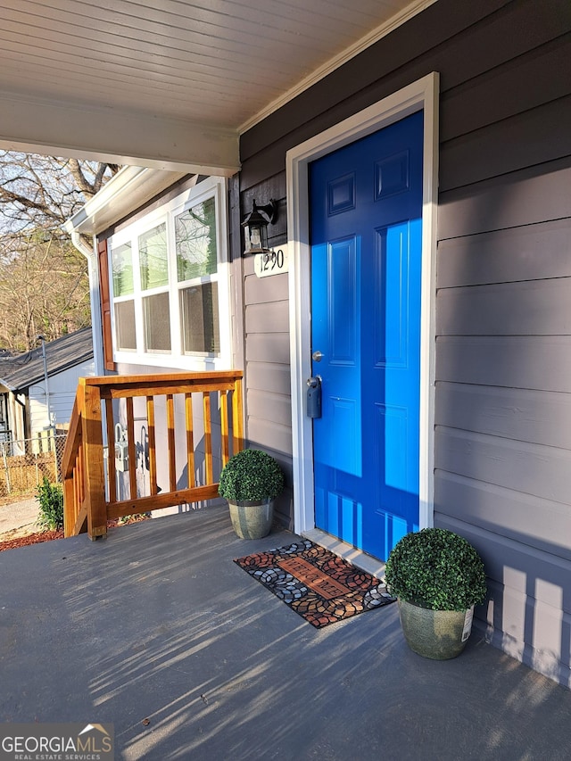 doorway to property with a porch