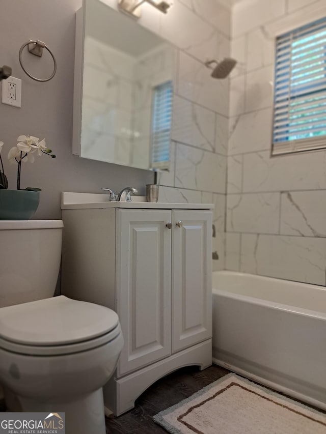 1290 Elizabeth Ave SW, Atlanta, GA 30310 - bathroom featuring toilet, vanity, and shower / washtub combination