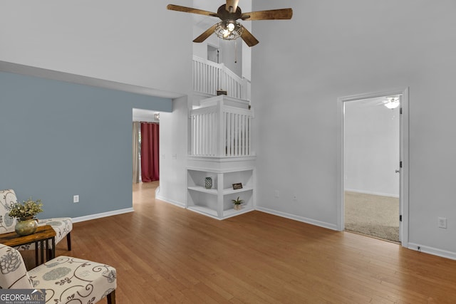 172 Sonata Cir, Pooler, GA 31322 - living room featuring a ceiling fan, a high ceiling, and wood finished floors