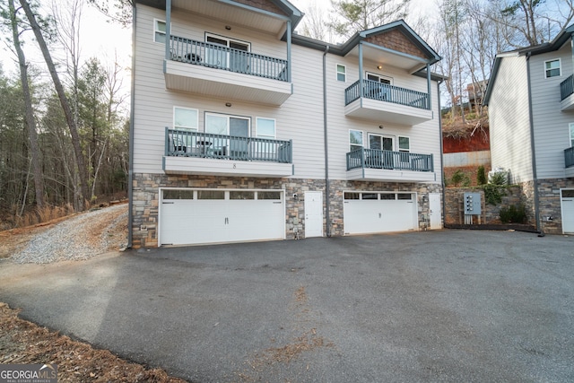 rear view of house featuring a garage