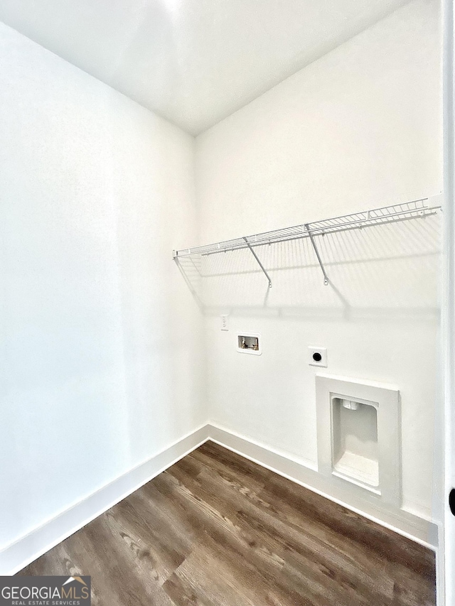 clothes washing area featuring hookup for a washing machine, electric dryer hookup, and dark hardwood / wood-style flooring