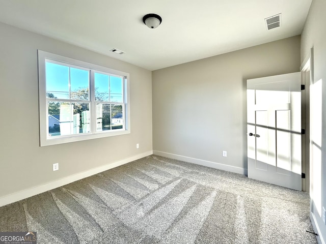 view of carpeted spare room