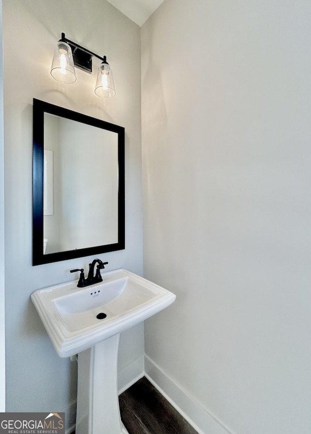 bathroom featuring sink and hardwood / wood-style floors