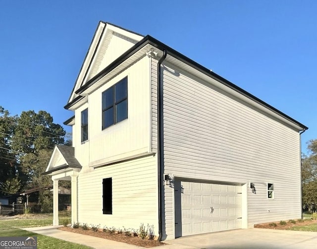 view of side of property with a garage