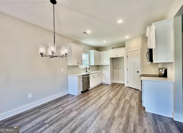 kitchen featuring white cabinetry, sink, light hardwood / wood-style flooring, and appliances with stainless steel finishes